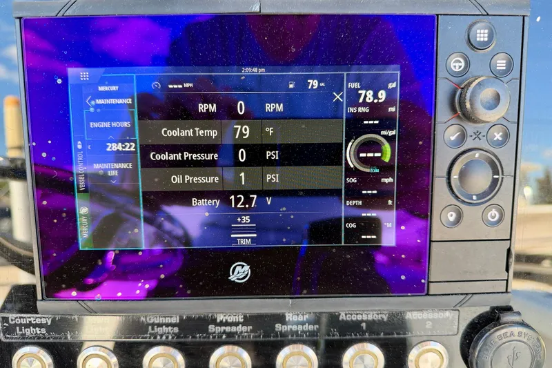 Slide: The Image of Boat dashboard display showing engine metrics for 2003 Contender 21 Open. - 18