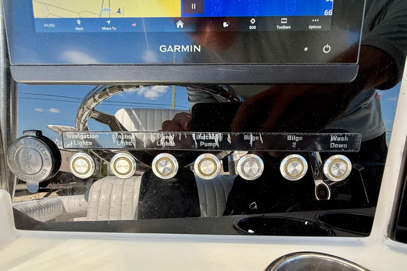 Slide: The Image of Control panel of a 2003 Contender 21 Open boat with Garmin navigation system. - 21