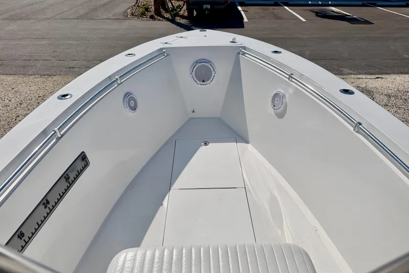Slide: The Image of 2003 Contender 21 Open boat interior with white seating and stainless steel railings. - 26
