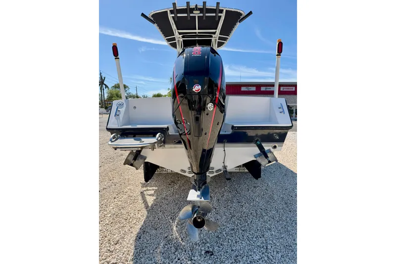 Slide: The Image of 2003 Contender 21 Open boat rear view with outboard motor and dual swim platforms. - 31