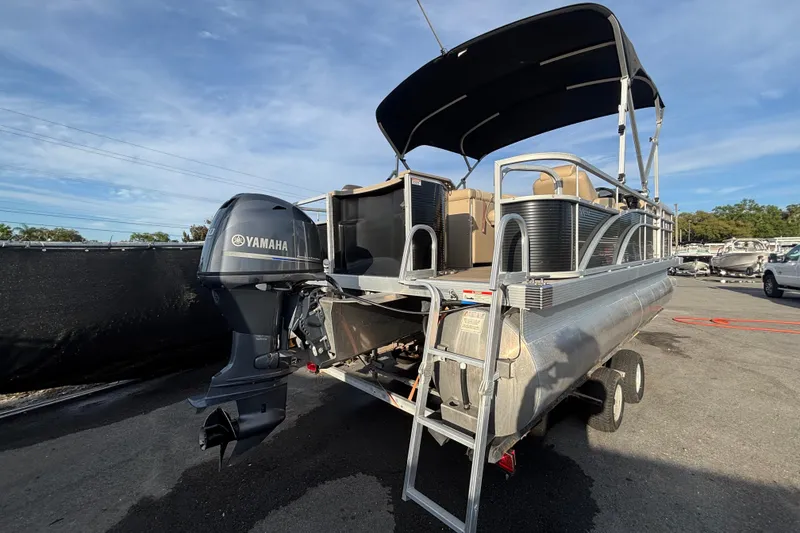 Slide: The Image of 2015 Bennington 20 SSX pontoon boat with Yamaha outboard motor and canopy. - 2