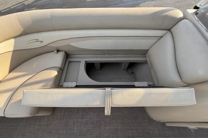 Slide: The Image of 2015 Bennington 20 SSX boat seat with open storage compartment. - 36