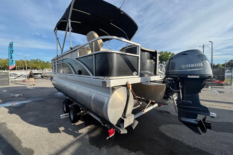 Slide: The Image of 2015 Bennington 20 SSX pontoon boat with Yamaha outboard motor on trailer. - 4