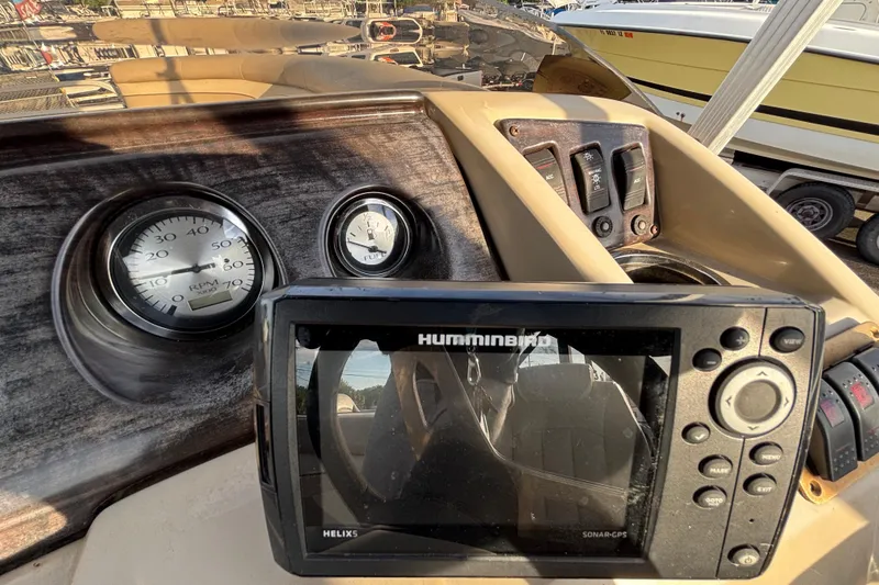 Slide: The Image of Dashboard of a 2015 Bennington 20 SSX boat with Humminbird sonar GPS. - 53