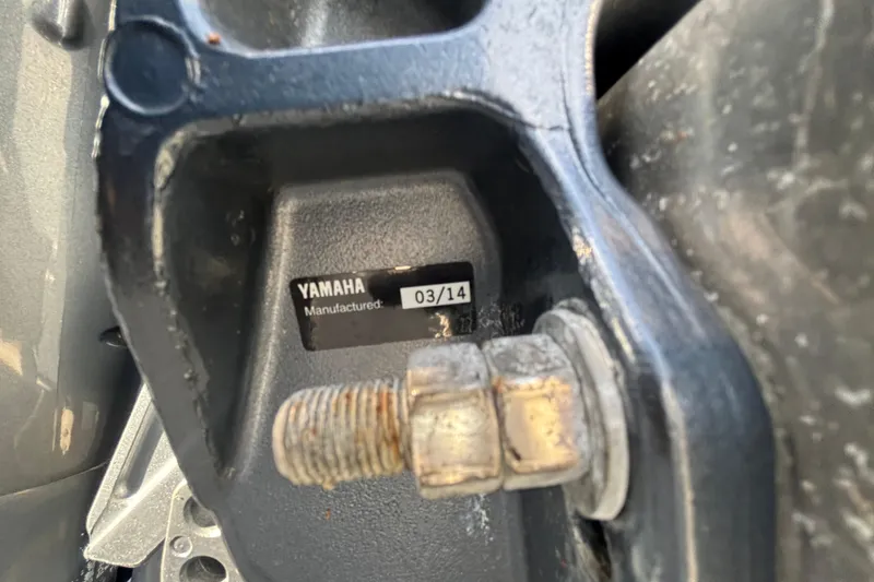 Slide: The Image of Close-up of Yamaha engine part on 2015 Bennington 20 SSX, manufactured March 2014. - 68