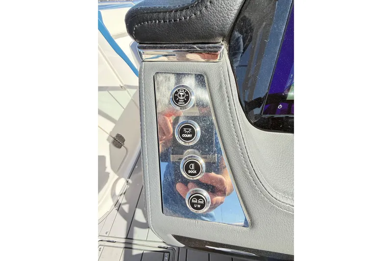 Slide: The Image of Control panel of 2023 Chaparral 250 OSX boat with various function buttons. - 24