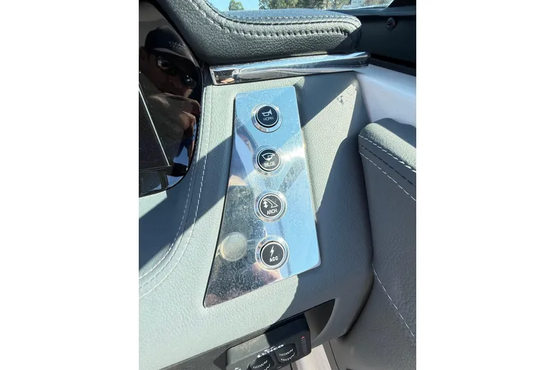 Slide: The Image of Control panel of 2023 Chaparral 250 OSX boat with labeled buttons. - 25