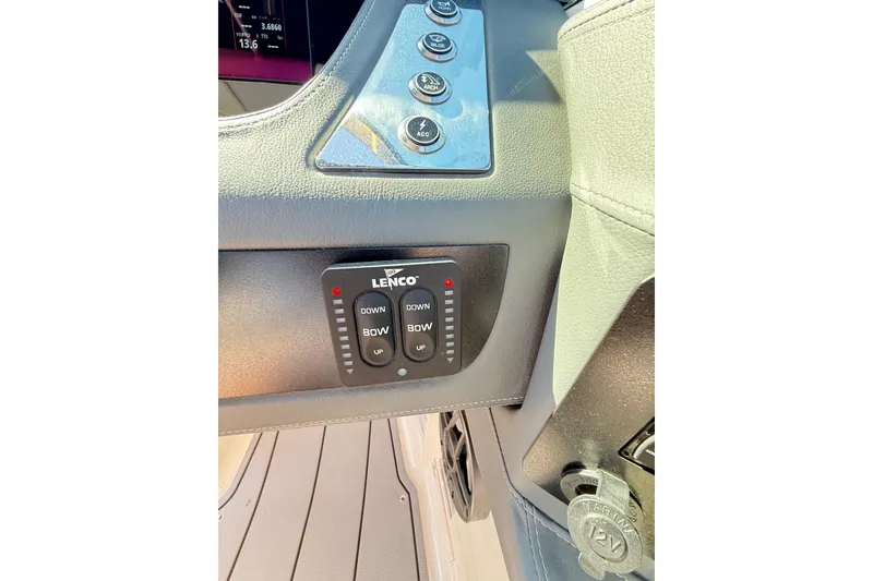 Slide: The Image of Control panel of 2023 Chaparral 250 OSX boat with Lenco trim tab switches. - 28