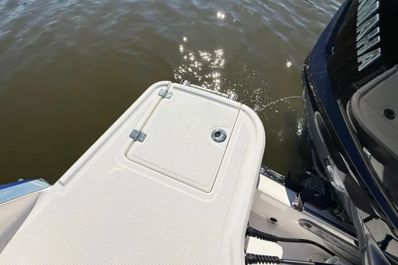 Slide: The Image of 2023 Chaparral 250 OSX boat platform with Yamaha engine on water. - 29