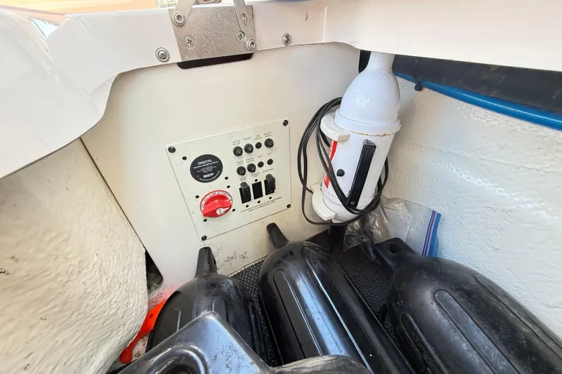 Slide: The Image of 2023 Chaparral 250 OSX boat control panel with fenders and wiring. - 33