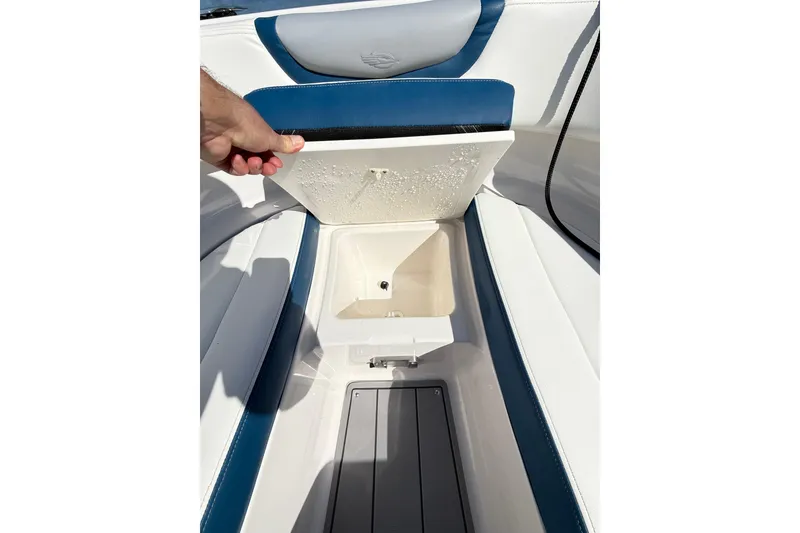 Slide: The Image of 2023 Chaparral 250 OSX boat interior with open storage compartment. - 36