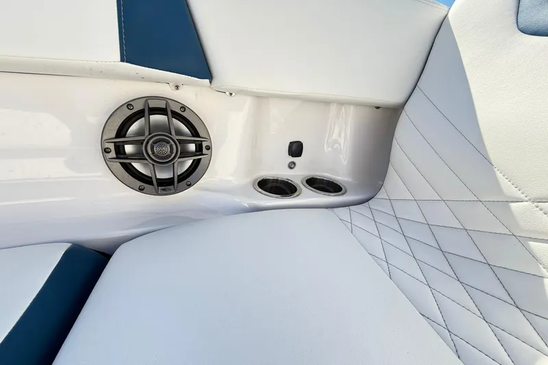 Slide: The Image of 2023 Chaparral 250 OSX boat interior with speaker and quilted seating. - 37
