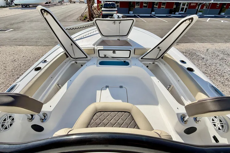 Slide: The Image of 2022 Tidewater 2300 Carolina Bay boat interior with open storage compartments. - 14