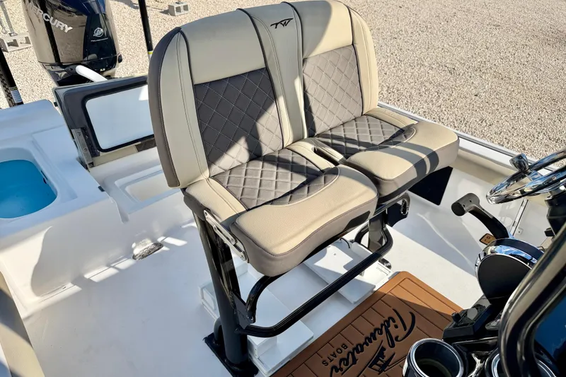Slide: The Image of 2022 Tidewater 2300 Carolina Bay boat interior with dual seats and steering console. - 17