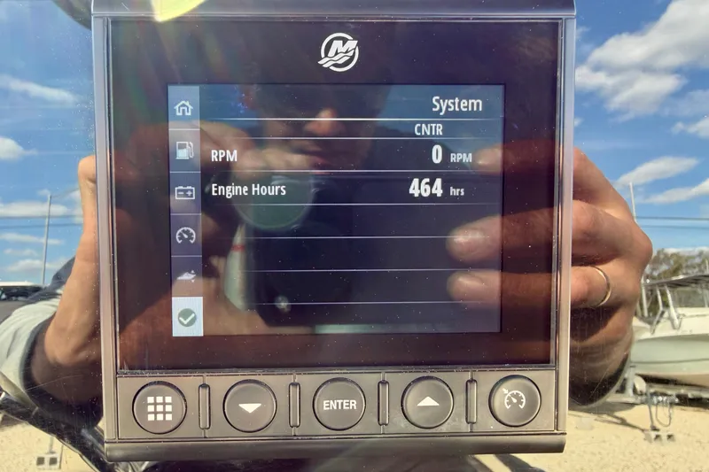 Slide: The Image of Display screen showing 2022 Tidewater 2300 Carolina Bay engine hours at 464. - 24