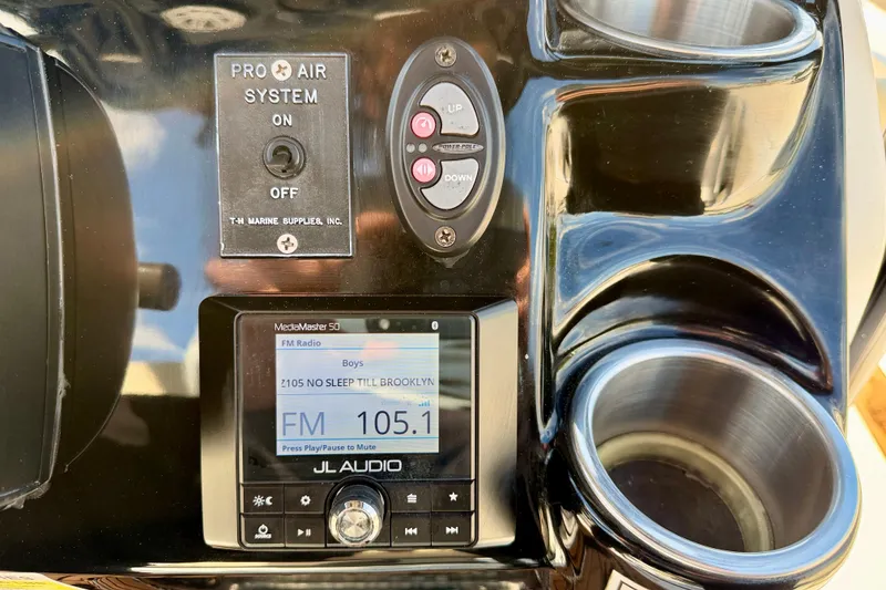 Slide: The Image of Control panel of 2022 Tidewater 2300 Carolina Bay boat with JL Audio system. - 25