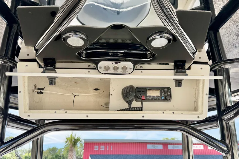 Slide: The Image of 2022 Tidewater 2300 Carolina Bay boat console with radio and controls. - 27