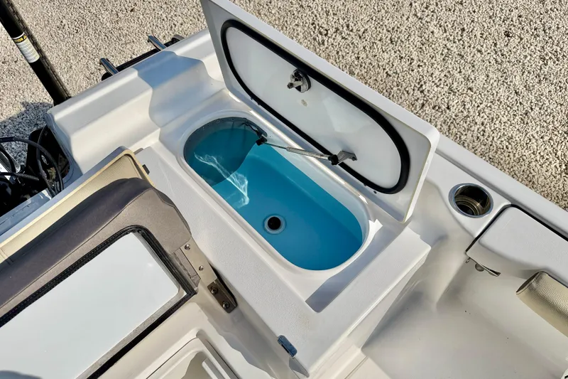 Slide: The Image of Open storage compartment on 2022 Tidewater 2300 Carolina Bay boat. - 32