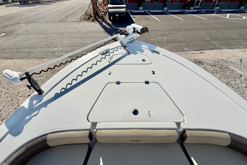 Slide: The Image of 2022 Tidewater 2300 Carolina Bay boat deck with trolling motor in parking lot. - 36