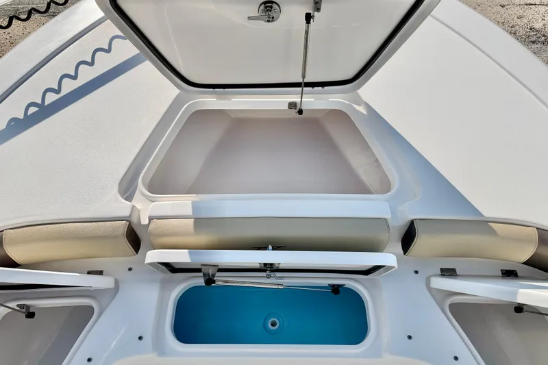 Slide: The Image of 2022 Tidewater 2300 Carolina Bay boat storage compartments and seating area. - 37