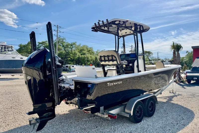 Slide: The Image of 2022 Tidewater 2300 Carolina Bay boat on trailer, featuring a Mercury outboard motor. - 5
