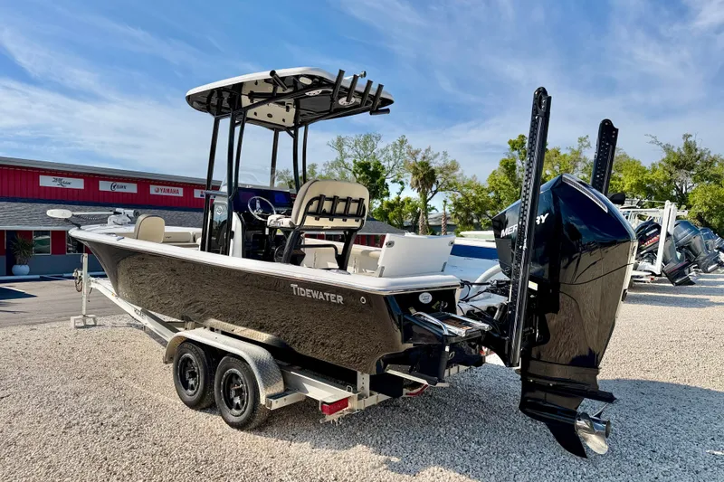 Slide: The Image of 2022 Tidewater 2300 Carolina Bay boat on trailer, featuring sleek design and powerful Mercury engine. - 7