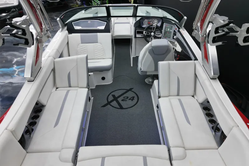 Slide: The Image of 2022 MasterCraft X24 boat interior with luxurious seating and modern dashboard. - 8