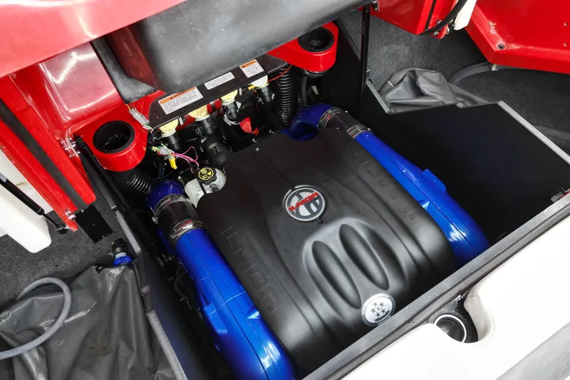 Slide: The Image of Engine compartment of a 2022 MasterCraft X24 boat, showcasing detailed components. - 10