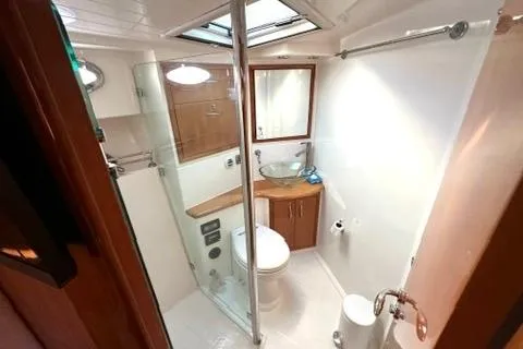 Slide: The Image of Bathroom interior of 2007 Maritimo 52 yacht with modern fixtures and glass shower. - 13