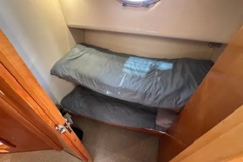 Slide: The Image of 2007 Maritimo 52 yacht cabin with bunk beds and wooden interior. - 15