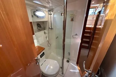 Slide: The Image of Bathroom interior of 2007 Maritimo 52 yacht with shower and wooden accents. - 17