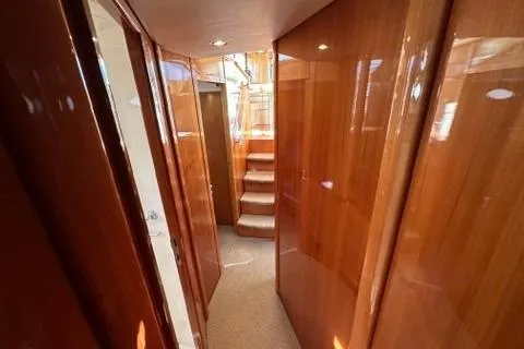 Slide: The Image of Luxurious wooden interior hallway of a 2007 Maritimo 52 yacht. - 18