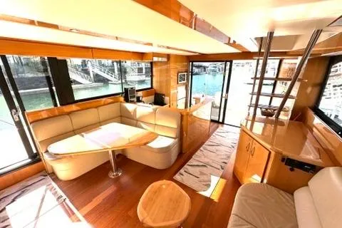 Slide: The Image of Luxurious interior of 2007 Maritimo 52 yacht with elegant seating and panoramic windows. - 20
