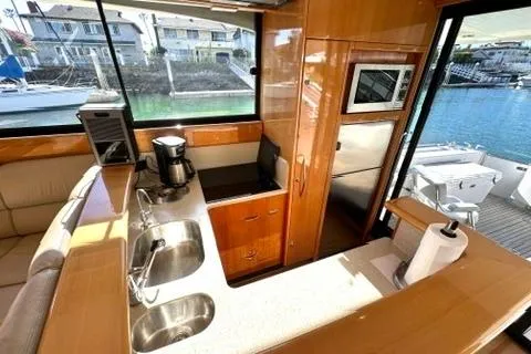 Slide: The Image of Luxurious 2007 Maritimo 52 yacht interior with modern kitchen and waterfront view. - 28