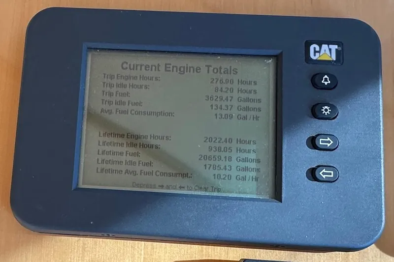 Slide: The Image of CAT engine monitor displaying fuel and engine hours for 2007 Maritimo 52 yacht. - 29