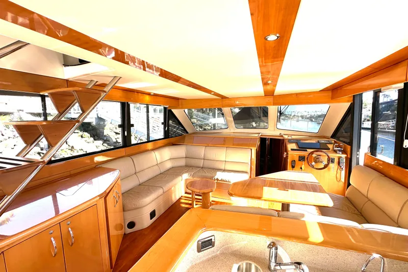 Slide: The Image of Luxurious interior of 2007 Maritimo 52 yacht with elegant wood finishes and spacious seating. - 3