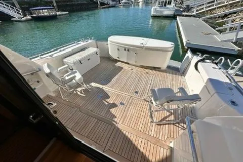 Slide: The Image of 2007 Maritimo 52 yacht deck with seating and storage, docked at marina. - 31