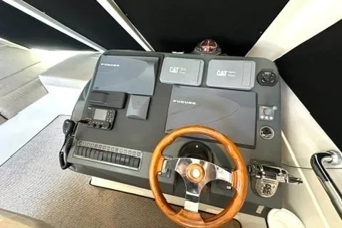 Slide: The Image of Helm of 2007 Maritimo 52 yacht with wooden steering wheel and navigation equipment. - 34