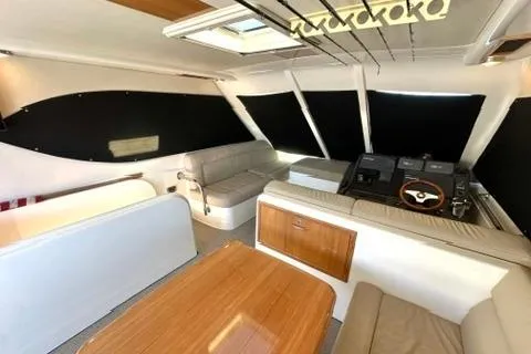 Slide: The Image of Interior of a 2007 Maritimo 52 yacht with modern seating and helm. - 35
