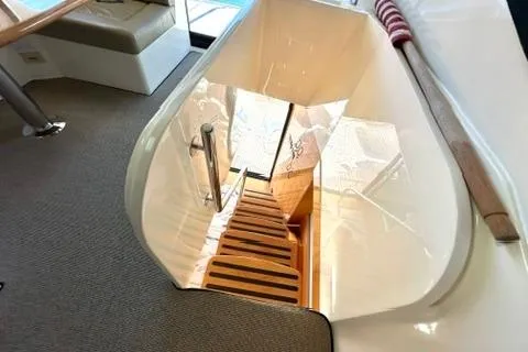 Slide: The Image of Interior view of 2007 Maritimo 52 yacht, featuring a sleek staircase and modern design. - 36