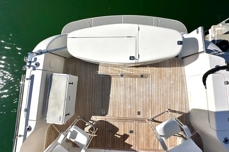 Slide: The Image of Aerial view of 2007 Maritimo 52 yacht deck with wooden flooring and seating. - 38