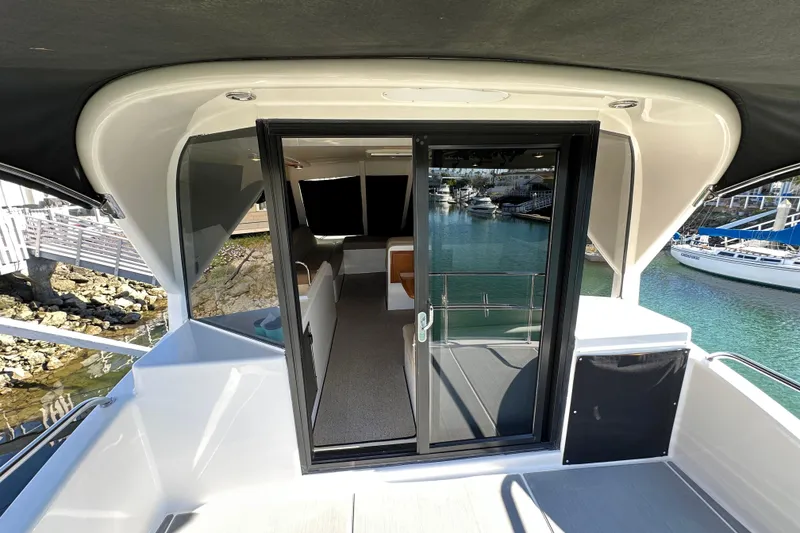 Slide: The Image of 2007 Maritimo 52 yacht interior with sliding glass door, overlooking marina. - 39