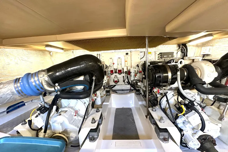 Slide: The Image of Engine room of a 2007 Maritimo 52 yacht, showcasing dual engines and mechanical components. - 41
