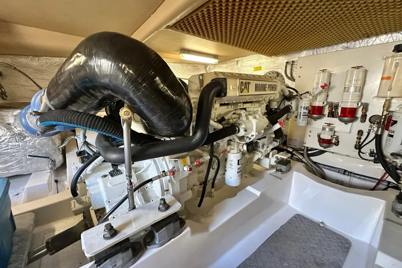 Slide: The Image of Engine room of a 2007 Maritimo 52 yacht featuring a CAT marine engine. - 42