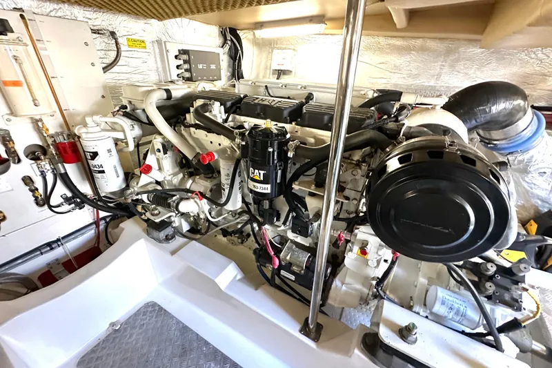 Slide: The Image of Engine room of a 2007 Maritimo 52 yacht, featuring a CAT marine engine. - 43