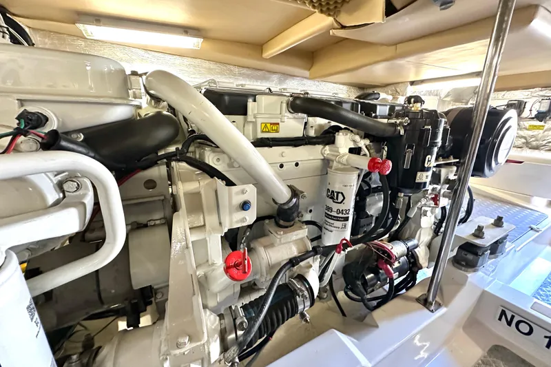 Slide: The Image of Engine room of a 2007 Maritimo 52 yacht, showcasing a well-maintained CAT engine. - 44