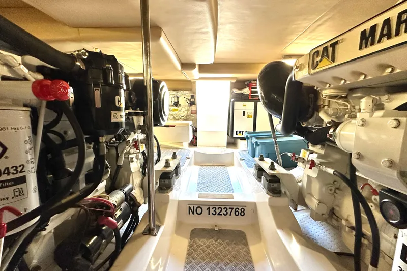Slide: The Image of Engine room of a 2007 Maritimo 52 yacht, featuring CAT machinery and equipment. - 46