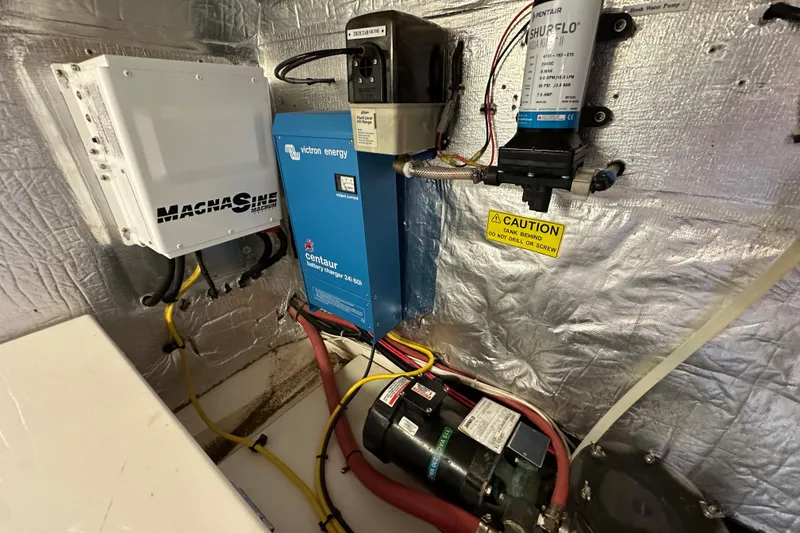 Slide: The Image of Electrical components in a 2007 Maritimo 52 yacht engine room. - 49