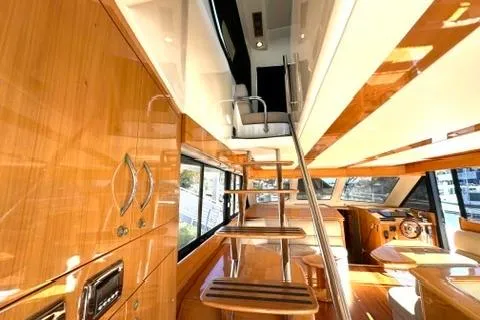 Slide: The Image of Luxurious interior of 2007 Maritimo 52 yacht with wooden finishes and modern design. - 5