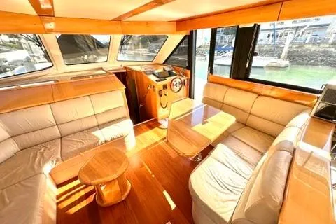 Slide: The Image of Luxurious interior of a 2007 Maritimo 52 yacht with elegant wood finishes. - 7